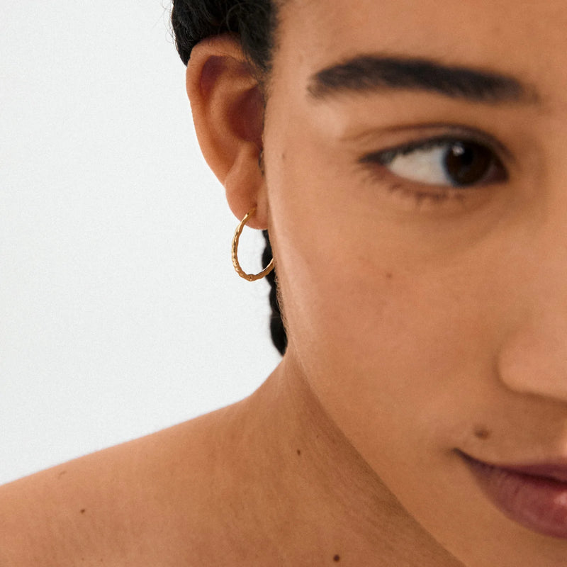 Between Gold Plated Hoops