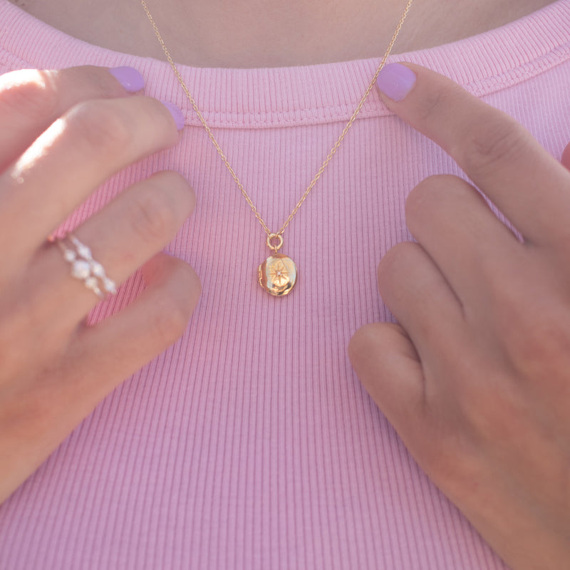 Oval Star-Set Silver Locket with White Sapphire