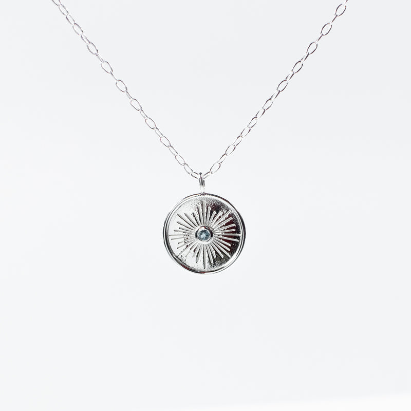 Rimmed Round Silver Necklace With Blue Topaz
